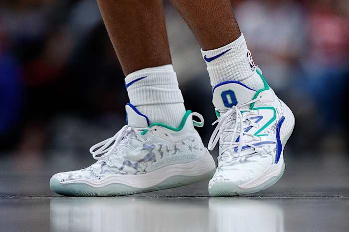 View of Tyrese Maxey's white New Balance shoes.